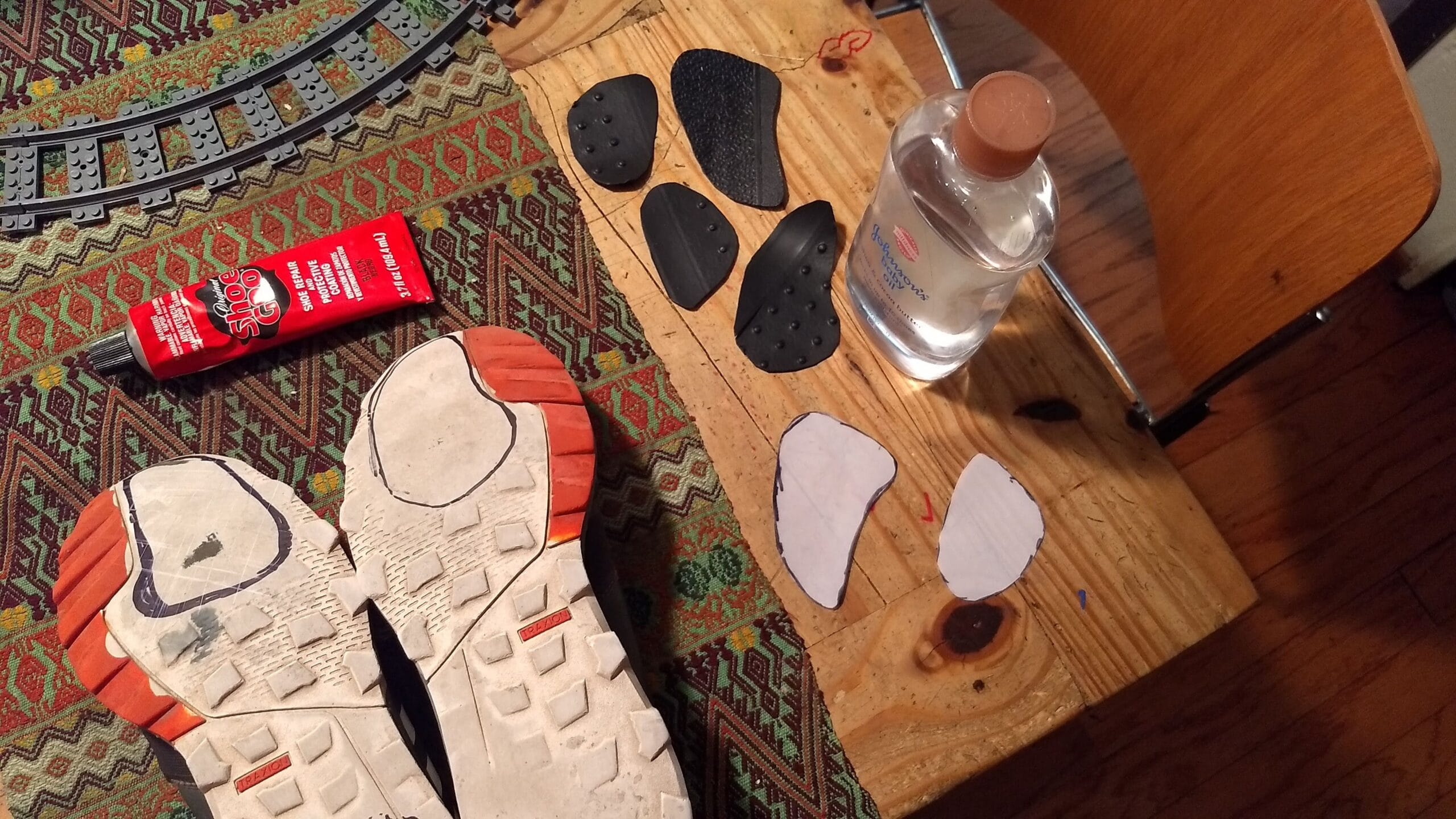 I’ve been partially resoling sneakers using old car mats, heel plates, and Shoe Goo. Make sure you have a ventilated space or a mask when using Shoe Goo! Credit: Neal Gorenflo. 