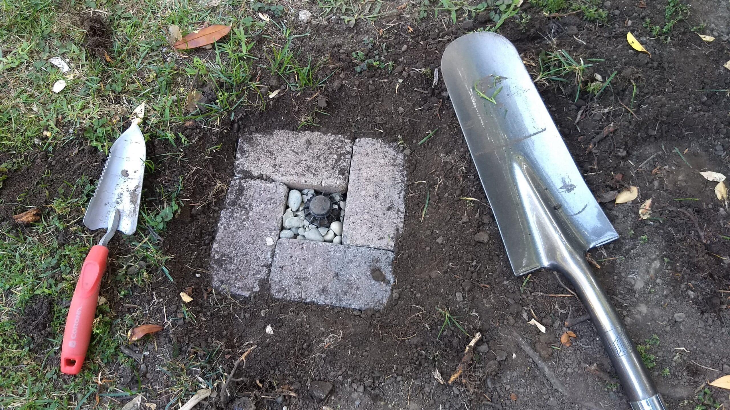One of the hundreds of irrigation system repair jobs I’ve done this year. Here I installed a new rotor and built a little protective fort around it. Credit: Neal Gorenflo