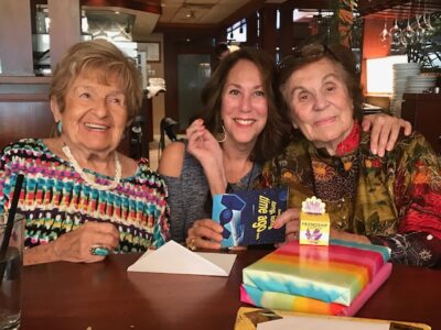 three older women sitting together at a restaurant