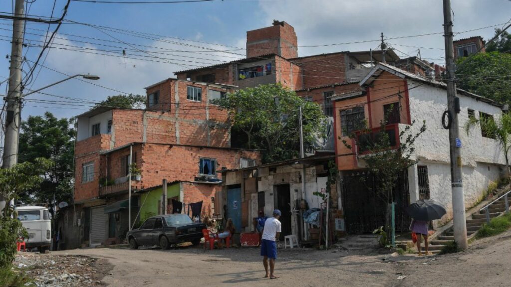 View of the main entrance of Vila Nova Esperanca, a 'green favela' that utilizes the principles of permaculture and fights to be a model of sustainable living (Sao Paulo, Brazil - Feb 2020) Credit: Nelson Almeida - sustainable housing