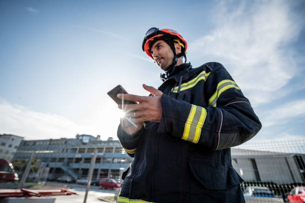 Watch Duty- Firefighters in a rescue operation training, holding a cellphone