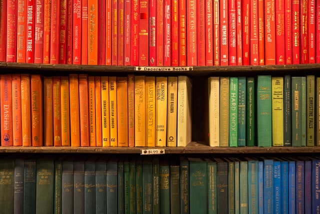 Native American Heritage Month, stack of multi-colored books, Credit: Jason Leung for Unsplash